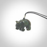 This picture shows a pendant that we designed in New Zealand jade. It is a little green bear that has a walking stance and is carved in detail. A really attractive and eye-catching piece of handmade jewellery. The cord is hand plaited braid and the length can be adjusted.
